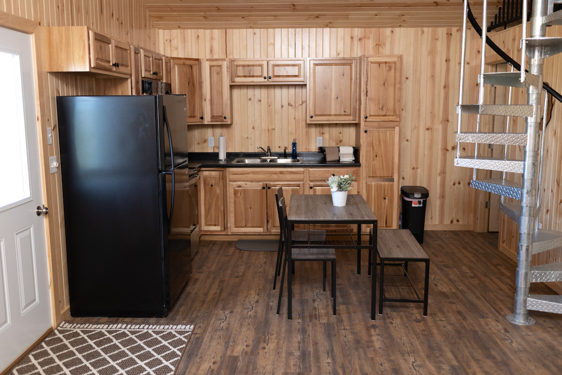 Restful Refuge cabin kitchen and dining area by Devils Lake, North Dakota
