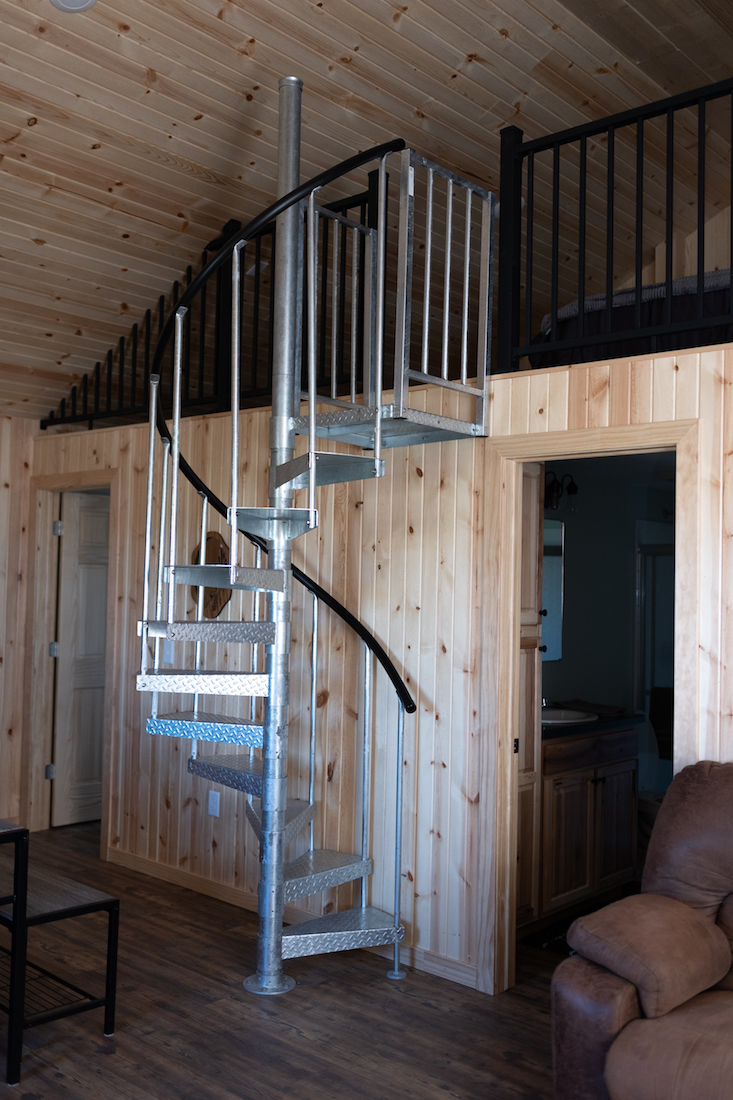 Restful Refuge cabin stairs to loft by Devils Lake, North Dakota